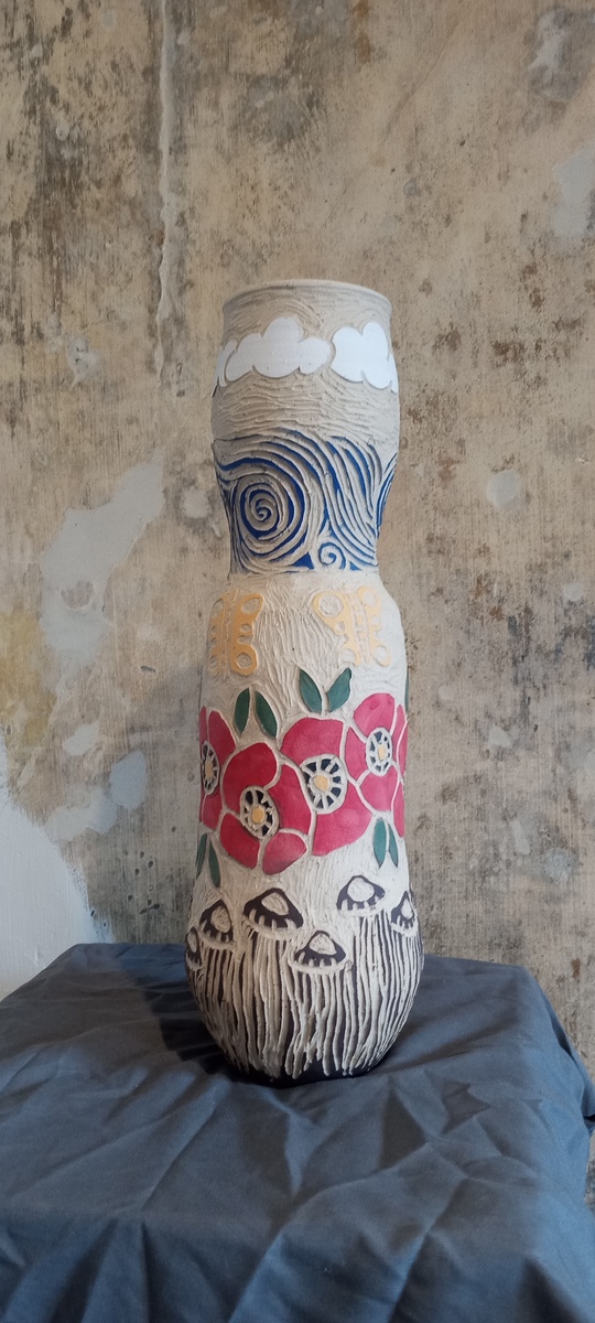 Tall carved vase
